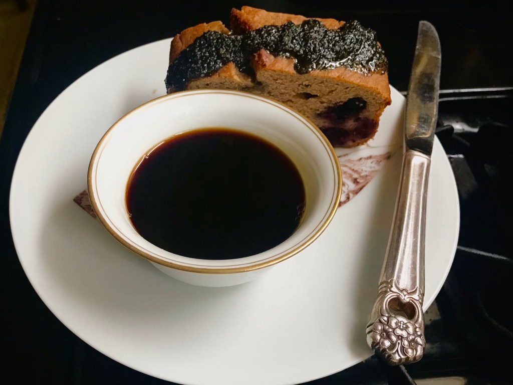 A coffee, black tahini on blueberry basil sweetbread&nbsp;start