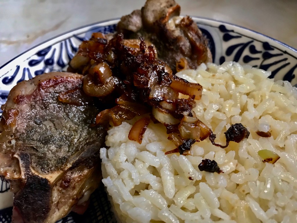 Thyme with shallots on lamb chops on&nbsp;rice