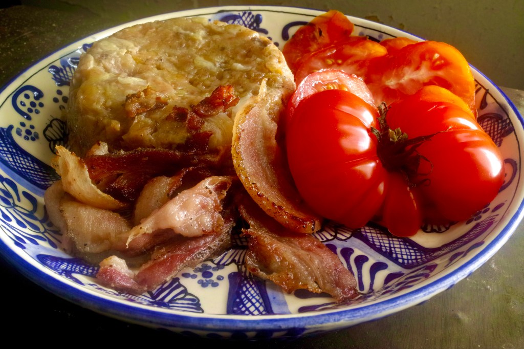 Plantains with garlic, wild boar bacon, heirloom&nbsp;tomatoes