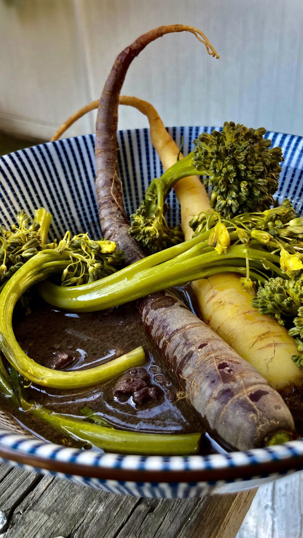 Amazingly earthy tasting carrots, next to broccolini, on a bed of lamb&nbsp;stew