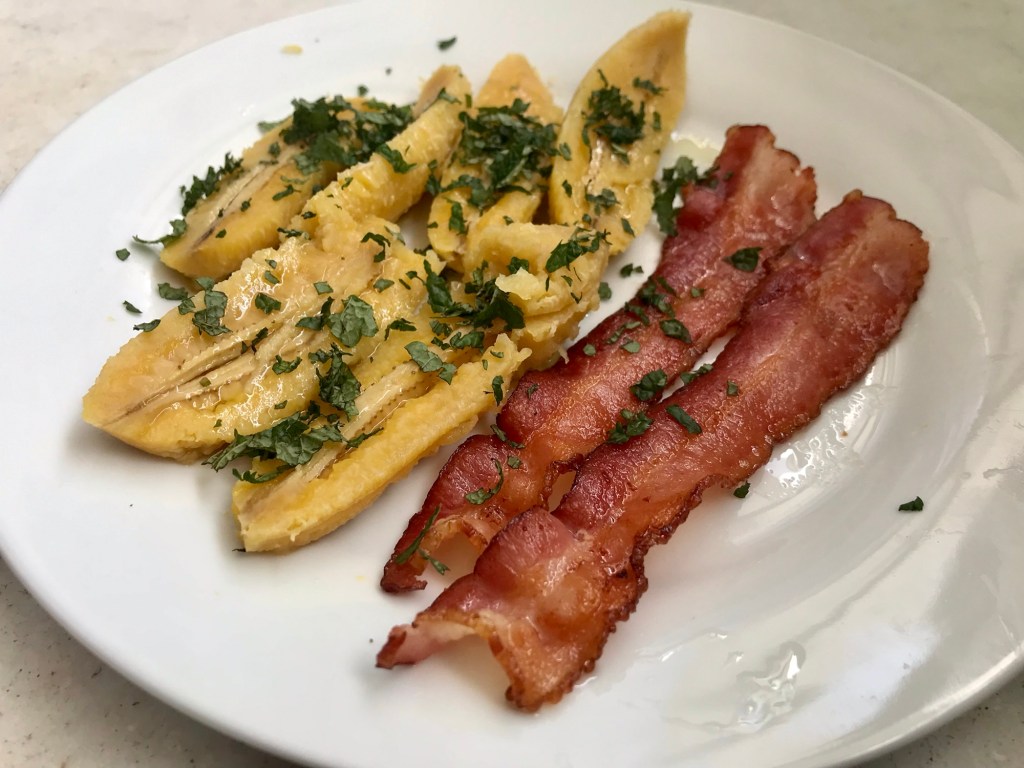 Bacon, small green bananas, and toronjil (lemon&nbsp;balm)